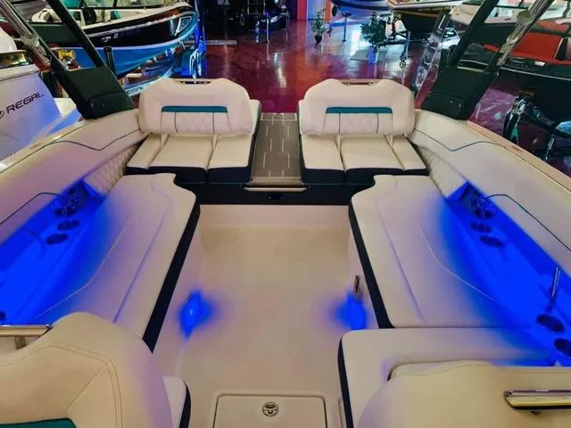Slide: The Image of Luxurious interior of 2022 Regal LS6 boat with blue ambient lighting. - 7