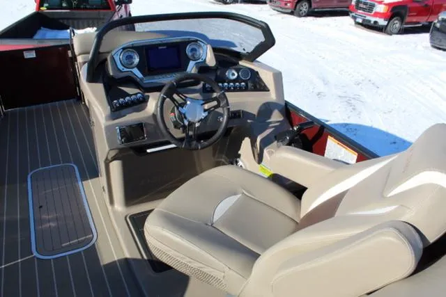 Slide: The Image of 2019 Sylvan S3 boat interior with steering wheel and dashboard controls. - 13