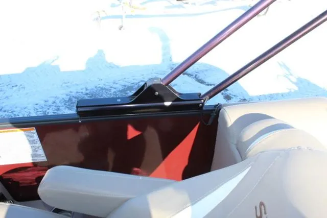 Slide: The Image of 2019 Sylvan S3 boat interior with beige seating and metal frame detail. - 17