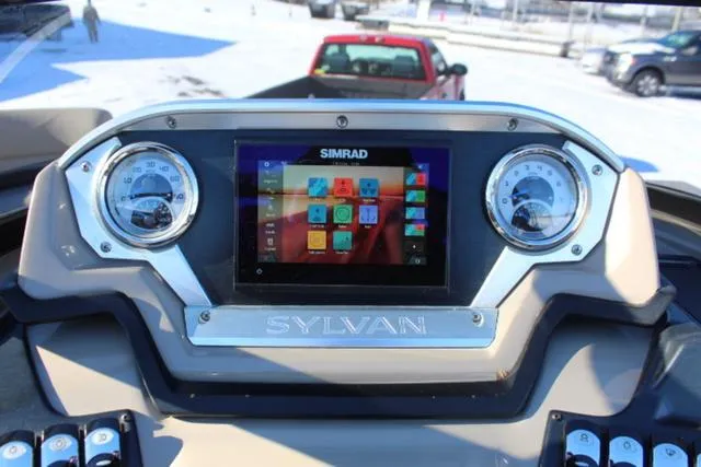 Slide: The Image of Dashboard of a 2019 Sylvan S3 boat with Simrad display and gauges. - 21