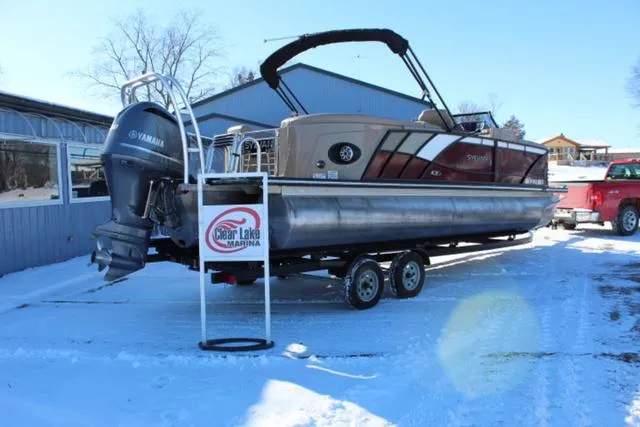 Slide: The Image of 2019 Sylvan S3 pontoon boat on trailer at Clear Lake Marina in snowy setting. - 3