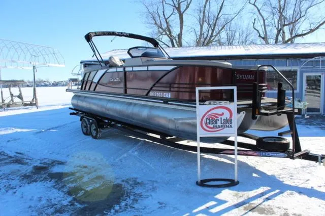 Slide: The Image of 2019 Sylvan S3 pontoon boat on trailer at Clear Lake Marina in snowy setting. - 4