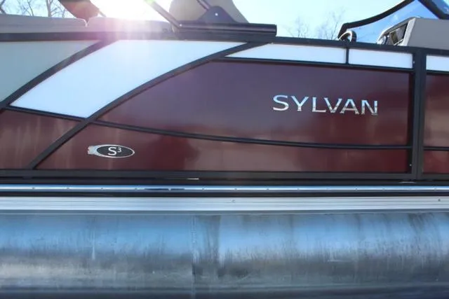 Slide: The Image of 2019 Sylvan S3 pontoon boat with sleek red and white design. - 5