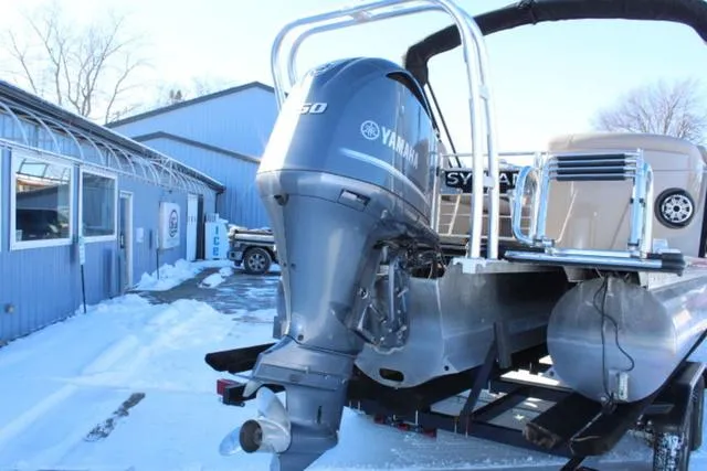 Slide: The Image of 2019 Sylvan S3 boat with Yamaha outboard motor in snowy setting. - 6