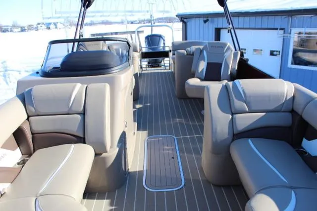 Slide: The Image of 2019 Sylvan S3 boat interior with beige seating and sleek design. - 7