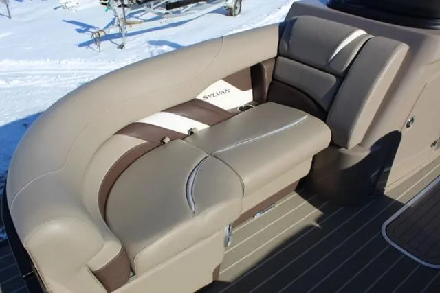 Slide: The Image of 2019 Sylvan S3 boat interior with beige and brown seating. - 8