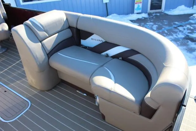 Slide: The Image of 2019 Sylvan S3 boat interior with beige and brown seating. - 9