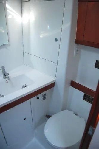 Slide: The Image of Bathroom interior of 2008 Beneteau Oceanis 49 yacht, featuring sink and toilet. - 14