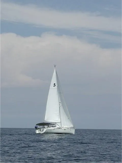 Slide: The Image of 2008 Beneteau Oceanis 49 sailing on open sea under clear skies. - 17
