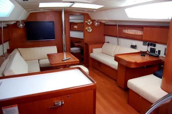 Slide: The Image of Luxurious interior of 2008 Beneteau Oceanis 49 yacht with wood finish and comfortable seating. - 5