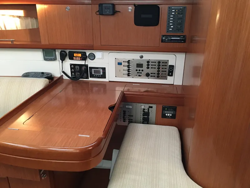 Slide: The Image of 2008 Beneteau Oceanis 49 yacht interior with navigation station and control panels. - 8