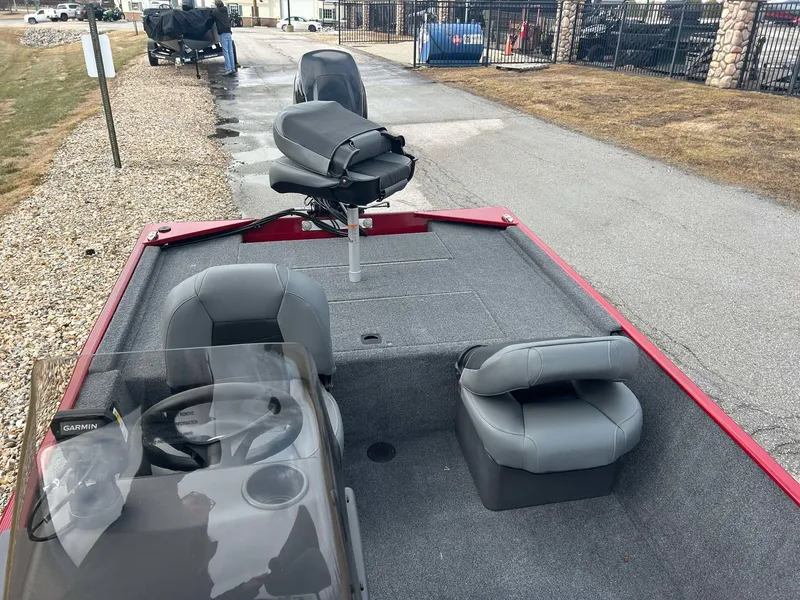 Slide: The Image of 2025 Tracker Bass Tracker Classic XL boat with gray seating and steering console. - 10