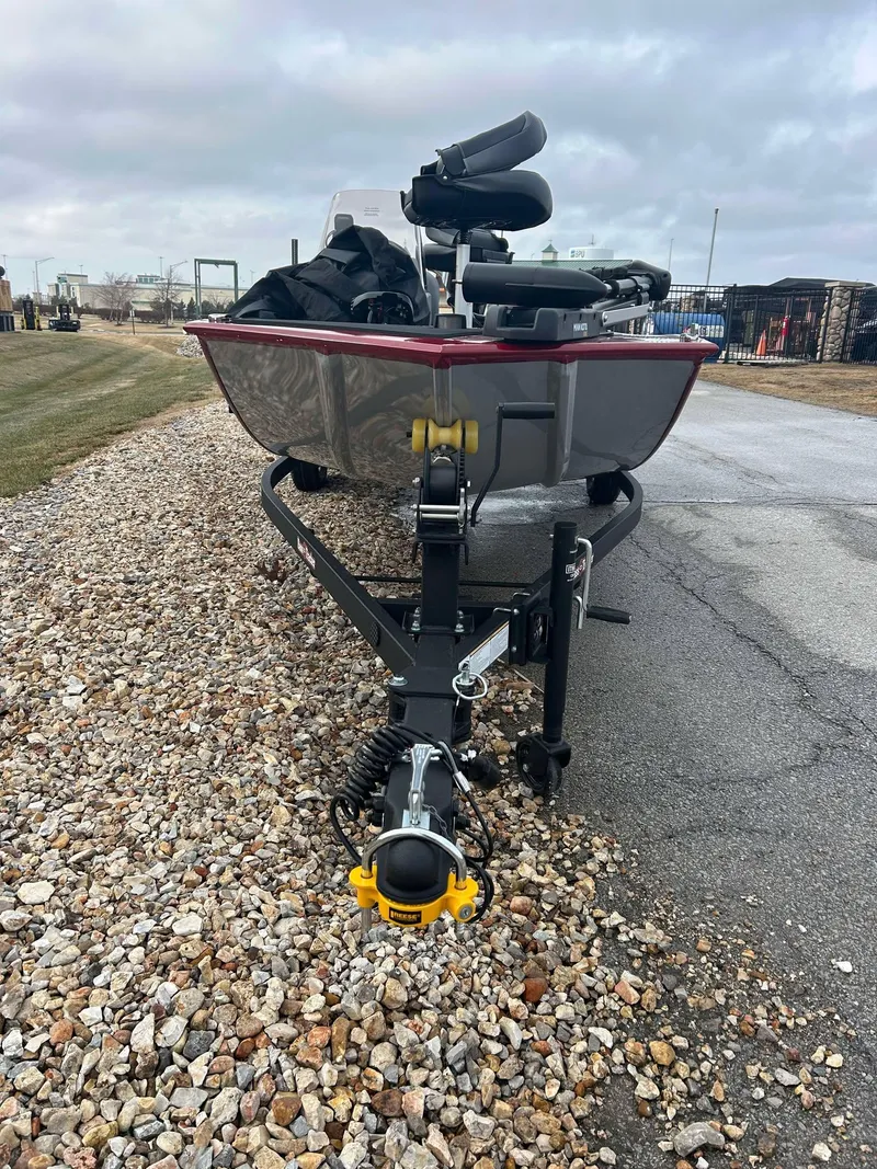 Slide: The Image of 2025 Tracker Bass Tracker Classic XL boat on trailer, parked on gravel. - 4