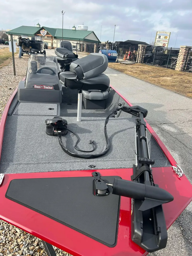 Slide: The Image of 2025 Tracker Bass Tracker Classic XL boat with seating and fishing equipment on deck. - 9