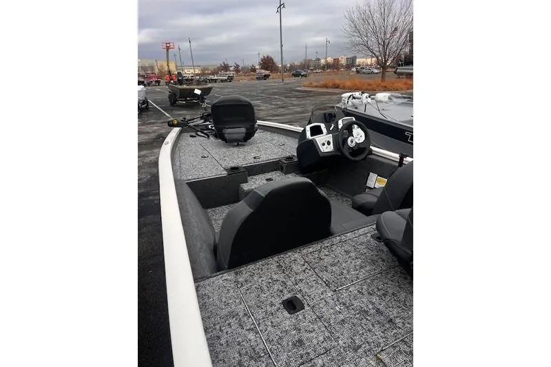 Slide: The Image of 2025 Tracker Pro Team 175 boat interior with steering console and seating. - 62