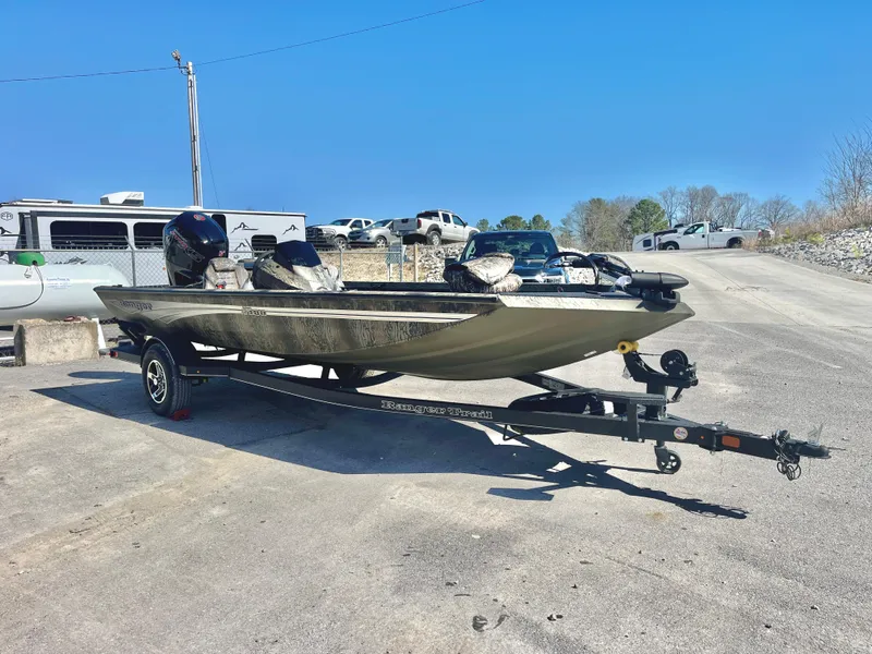 Slide: The Image of 2025 Ranger RT188 boat on trailer in outdoor setting, clear blue sky. - 1