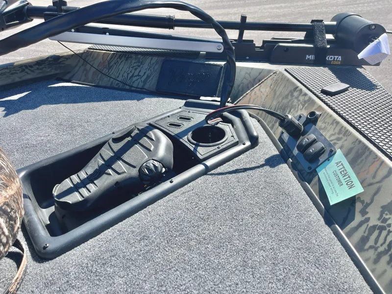 Slide: The Image of 2025 Ranger RT188 boat deck with control panel and fishing rod holder. - 10