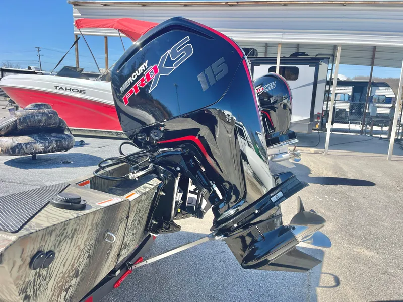 Slide: The Image of 2025 Ranger RT188 boat with Mercury Pro XS 115 engine in a marina setting. - 16