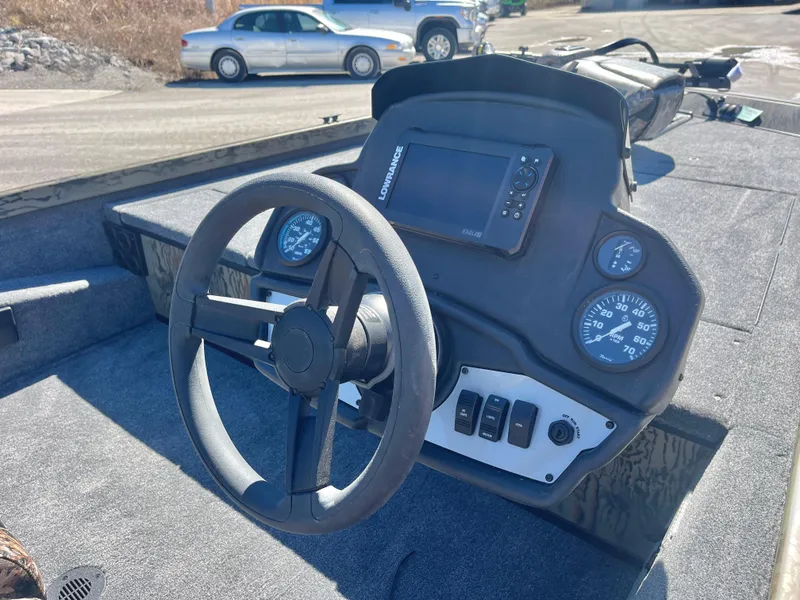 Slide: The Image of 2025 Ranger RT188 boat dashboard with steering wheel and electronic display. - 7