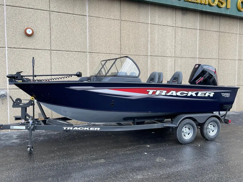 The Image of 2025 Tracker Targa V-18 Combo boat on trailer, parked outdoors. - 0