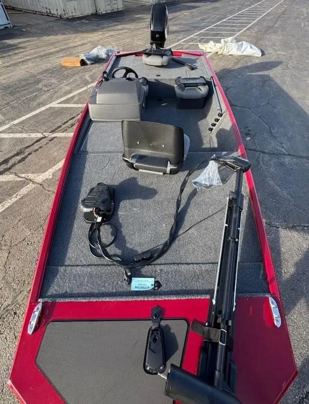 Slide: The Image of 2025 Tracker Bass Tracker Classic XL boat with red trim and fishing equipment on deck. - 6