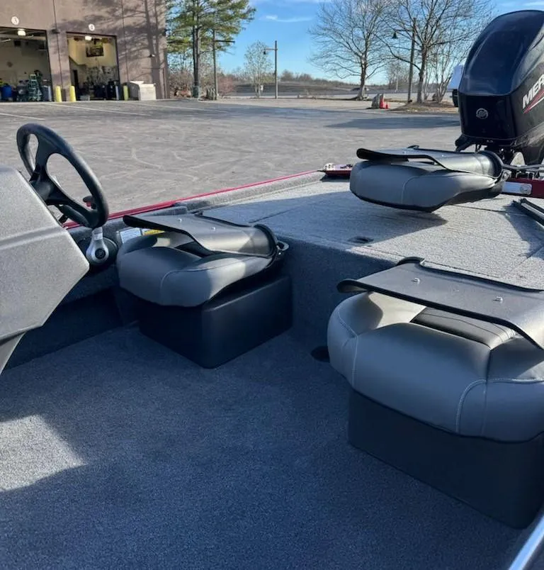 Slide: The Image of 2025 Tracker Bass Tracker Classic XL interior with seating and steering wheel. - 8