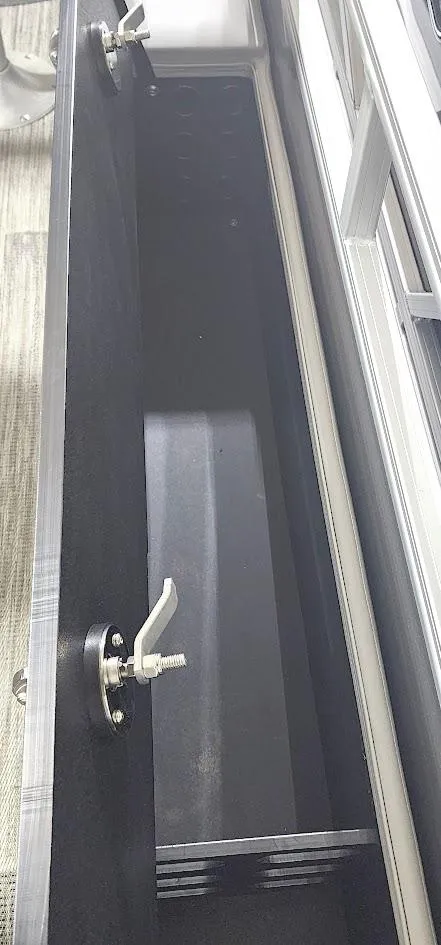 Slide: The Image of 2025 Ranger Reata 220F storage compartment with secure latches and spacious interior. - 12