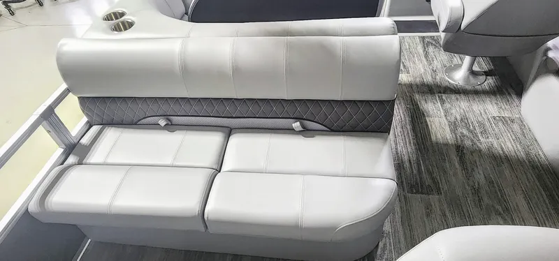 Slide: The Image of 2025 Ranger Reata 220F boat interior with plush seating and modern design. - 13