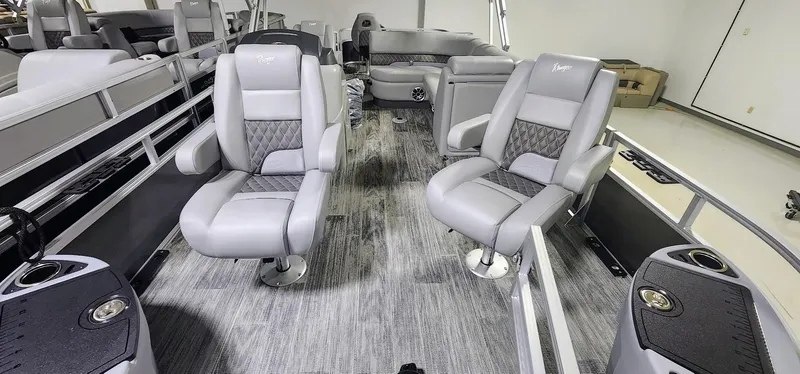 Slide: The Image of 2025 Ranger Reata 220F interior with plush gray seating and modern design. - 2