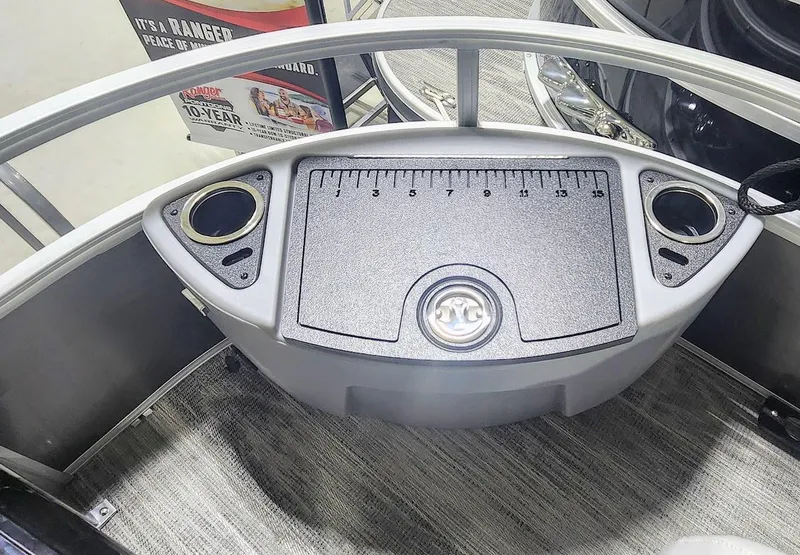 Slide: The Image of 2025 Ranger Reata 220F boat console with cup holders and measurement panel. - 3