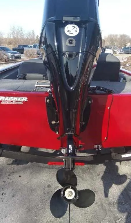 Slide: The Image of 2025 Tracker Pro 170 boat with a black outboard motor, rear view. - 4