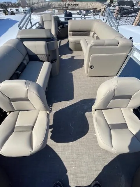 Slide: The Image of 2025 Sun Tracker Fishin' Barge 20 DLX interior with spacious seating and modern design. - 3