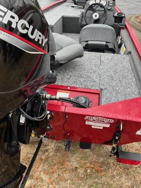 Slide: The Image of 2025 Tracker Pro 170 boat with Mercury engine, featuring gray seating and red exterior. - 2