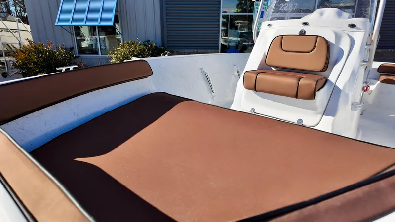 Slide: The Image of ALK2 Powerboats 18 CRS 2025 model with brown seating, outdoor display. - 10