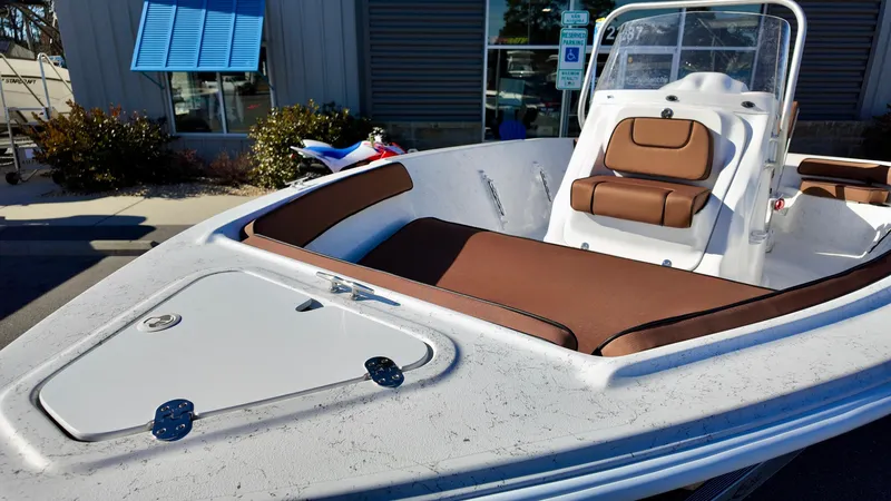 Slide: The Image of 2025 ALK2 Powerboats 18 CRS with brown seating and sleek design. - 11