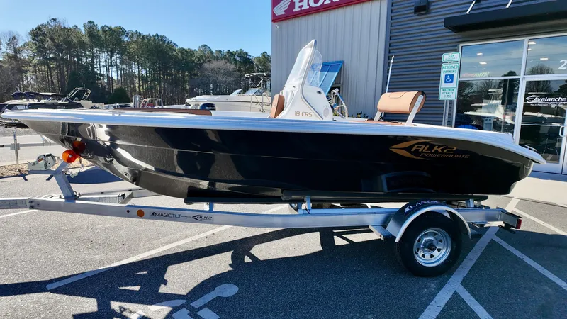 Slide: The Image of 2025 ALK2 Powerboats 18 CRS on trailer, parked outside dealership. - 13