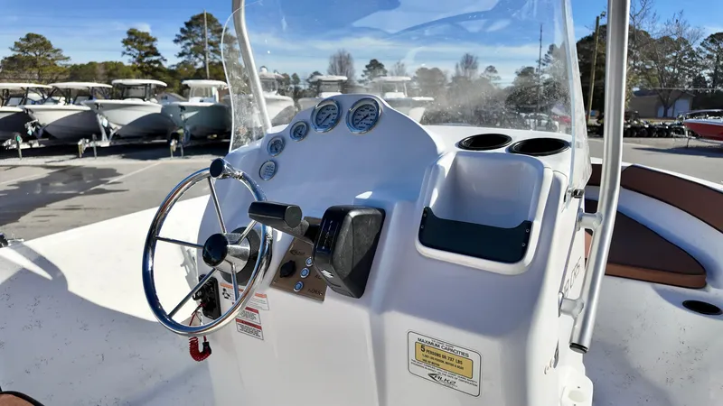Slide: The Image of 2025 ALK2 Powerboats 18 CRS dashboard with steering wheel and gauges. - 5