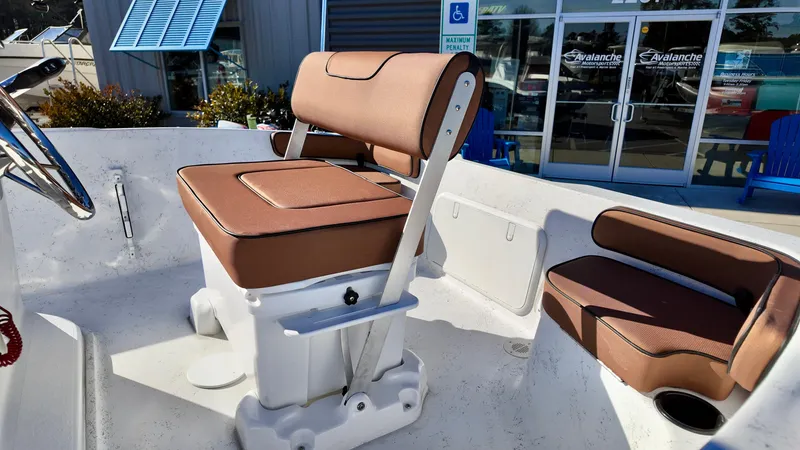 Slide: The Image of 2025 ALK2 Powerboats 18 CRS interior with brown seating and white deck. - 9