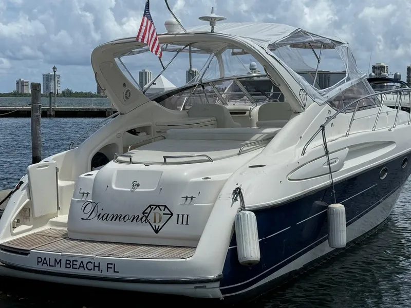 Slide: The Image of 2003 Cranchi Endurance 39 yacht docked in Palm Beach, FL, with American flag. - 3