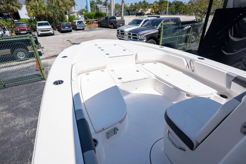 Slide: The Image of 2025 Robalo R246 CAYMAN boat interior with seating and storage compartments. - 13