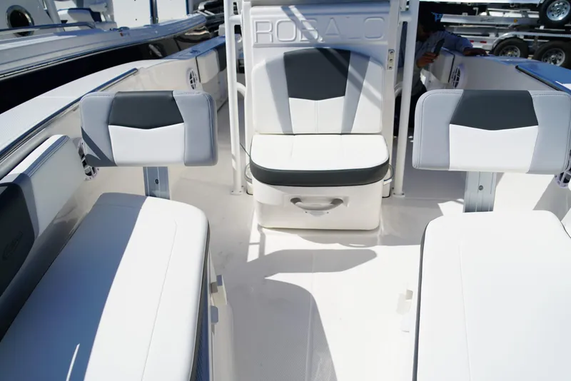 Slide: The Image of 2025 Robalo R200 boat interior with white and gray seating arrangement. - 10