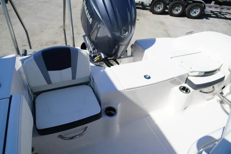 Slide: The Image of 2025 Robalo R200 boat interior with seating and Yamaha engine. - 17