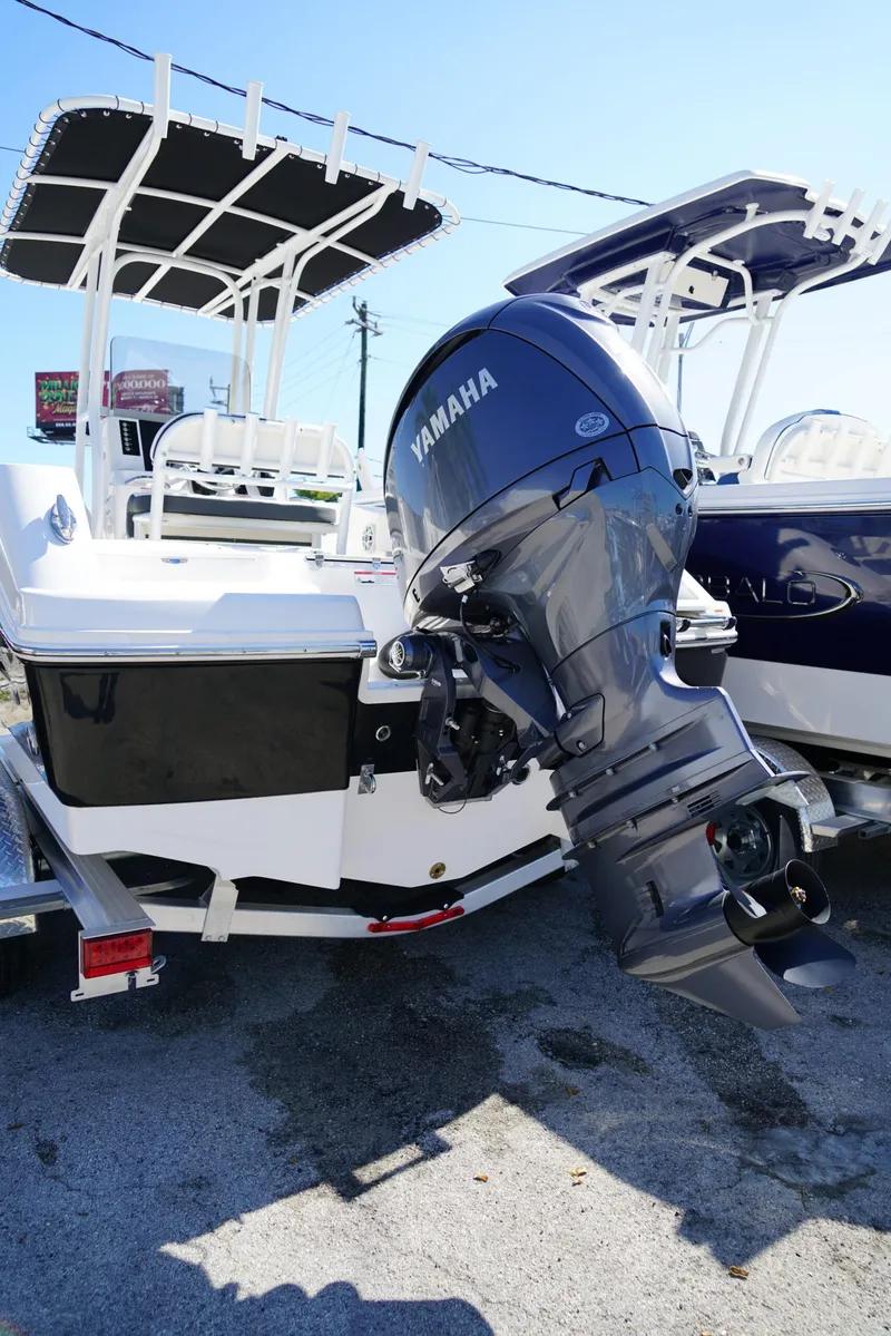 Slide: The Image of 2025 Robalo R200 boat with Yamaha outboard motor, displayed on a trailer. - 20