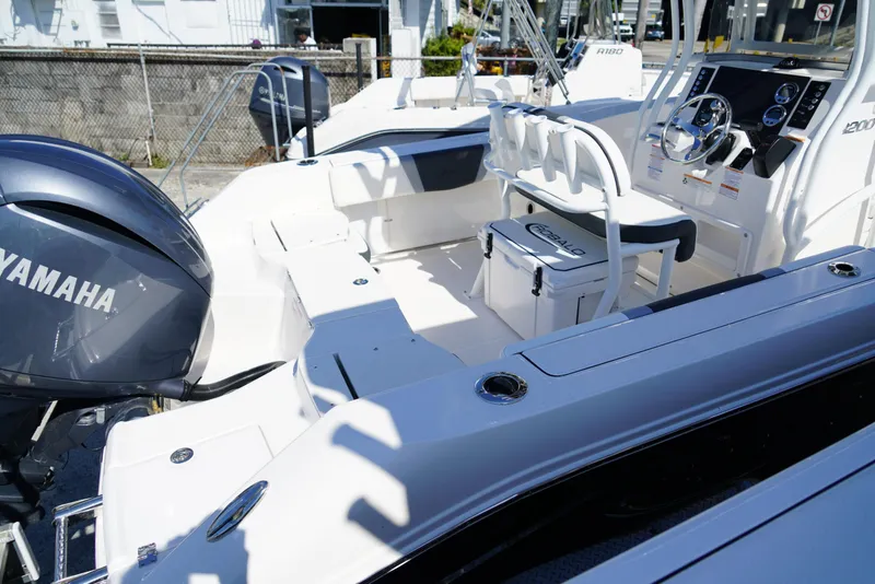 Slide: The Image of 2025 Robalo R200 boat interior with Yamaha engine, featuring seating and control console. - 26