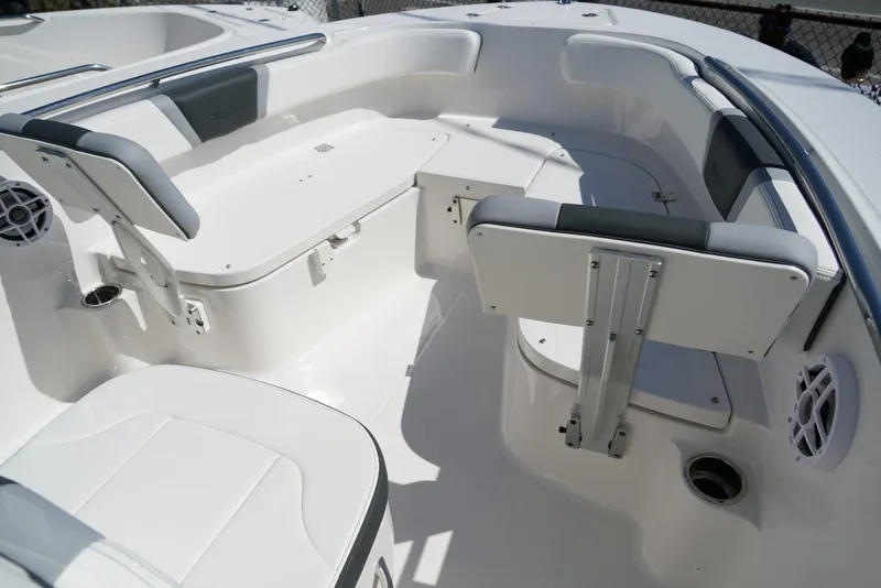 Slide: The Image of 2025 Robalo R200 boat interior with white seating and stainless steel accents. - 7