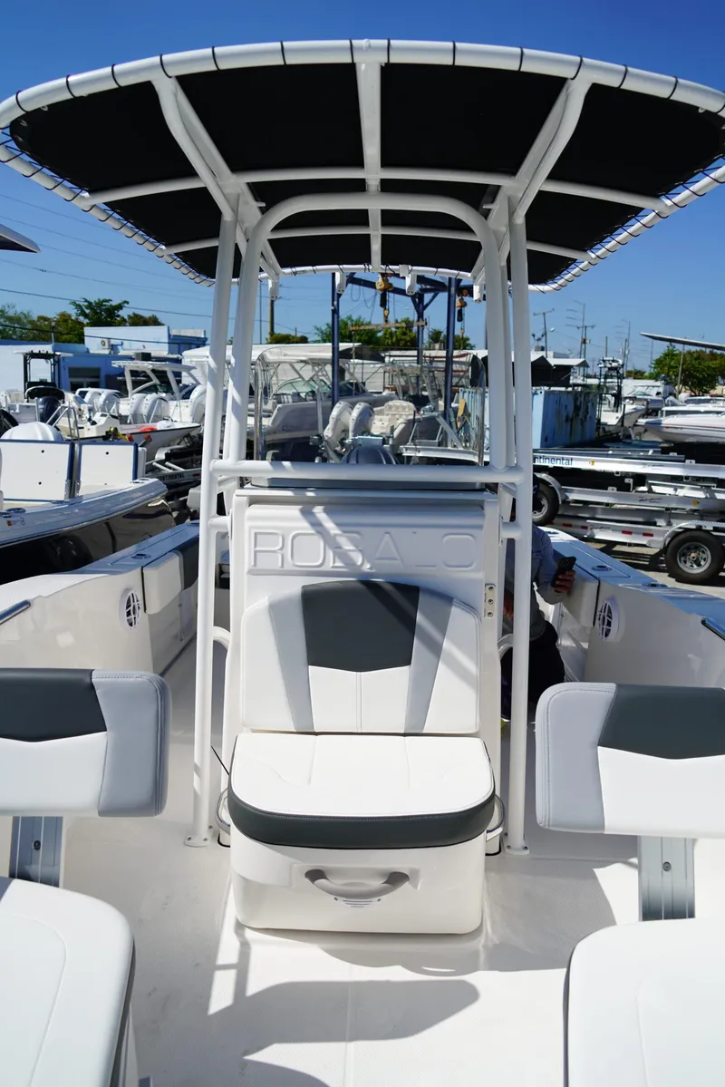 Slide: The Image of 2025 Robalo R200 boat interior with seating and T-top canopy. - 9