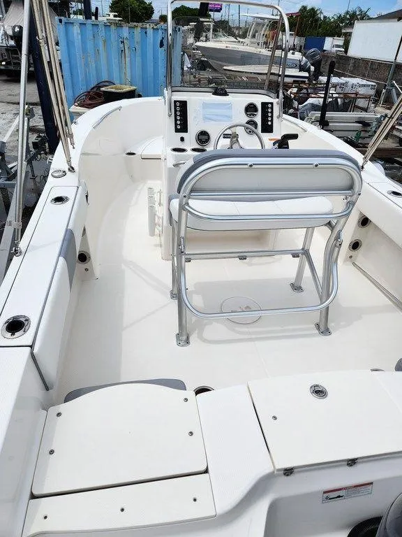 Slide: The Image of 2020 Robalo R180 boat interior with helm, seating, and storage compartments. - 3