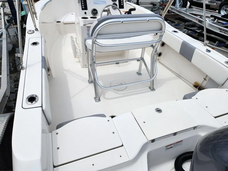 Slide: The Image of 2020 Robalo R180 boat interior with seating and control console. - 4