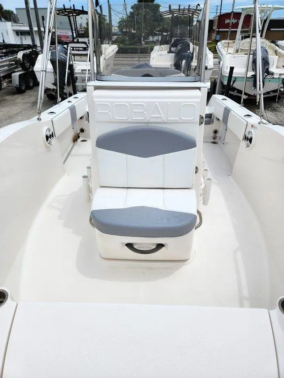 Slide: The Image of 2020 Robalo R180 boat interior with seating and storage. - 6