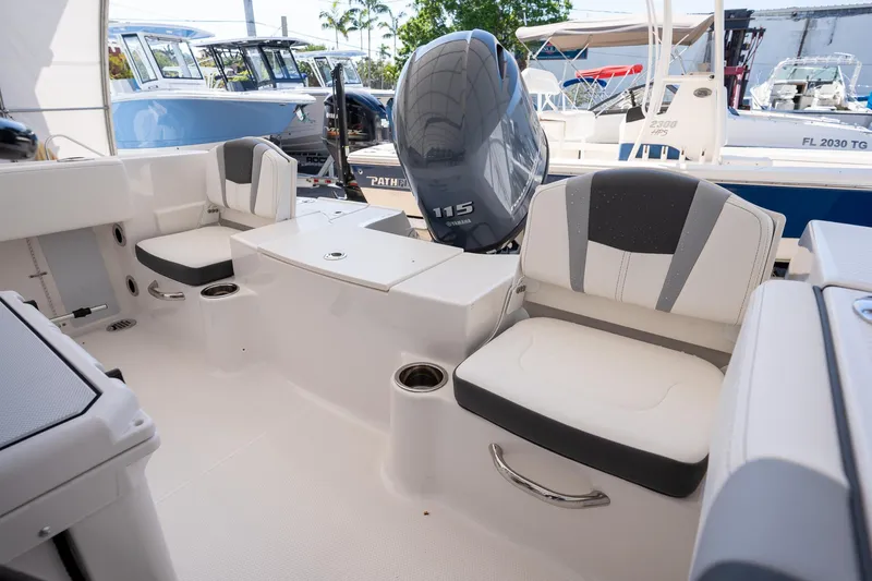 Slide: The Image of 2025 Robalo R180 boat interior with seating and Yamaha 115 engine. - 14